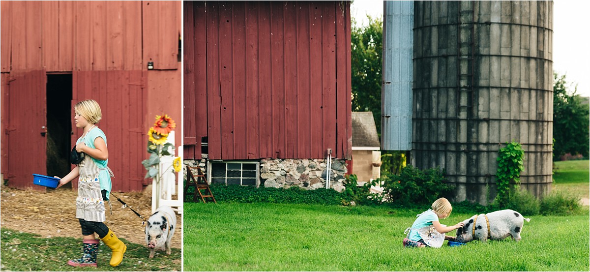 Young girl feeds her pig during Bea Hive Farm photography session.