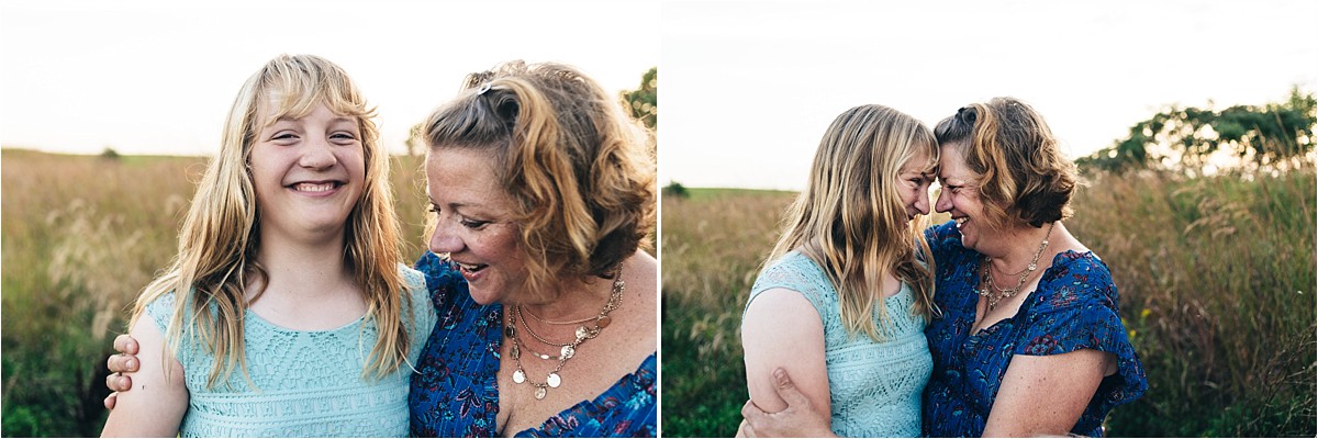 Mother and daughter laugh and look at each other.