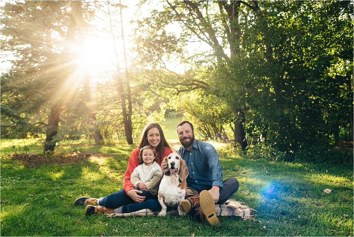 Family of three and their dog during family photos. 