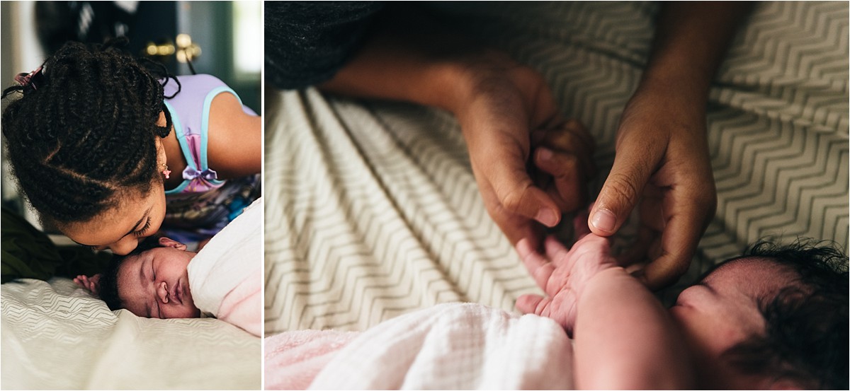 Young girl kisses her new baby sister in lifestyle in-home photography session.