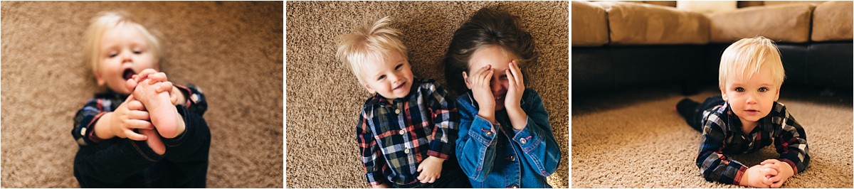 Kids lie on floor and smile up at camera.