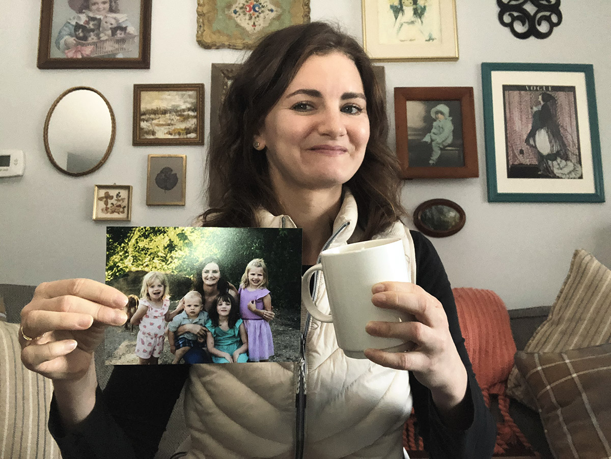 Jen Martodam holds photo mug.
