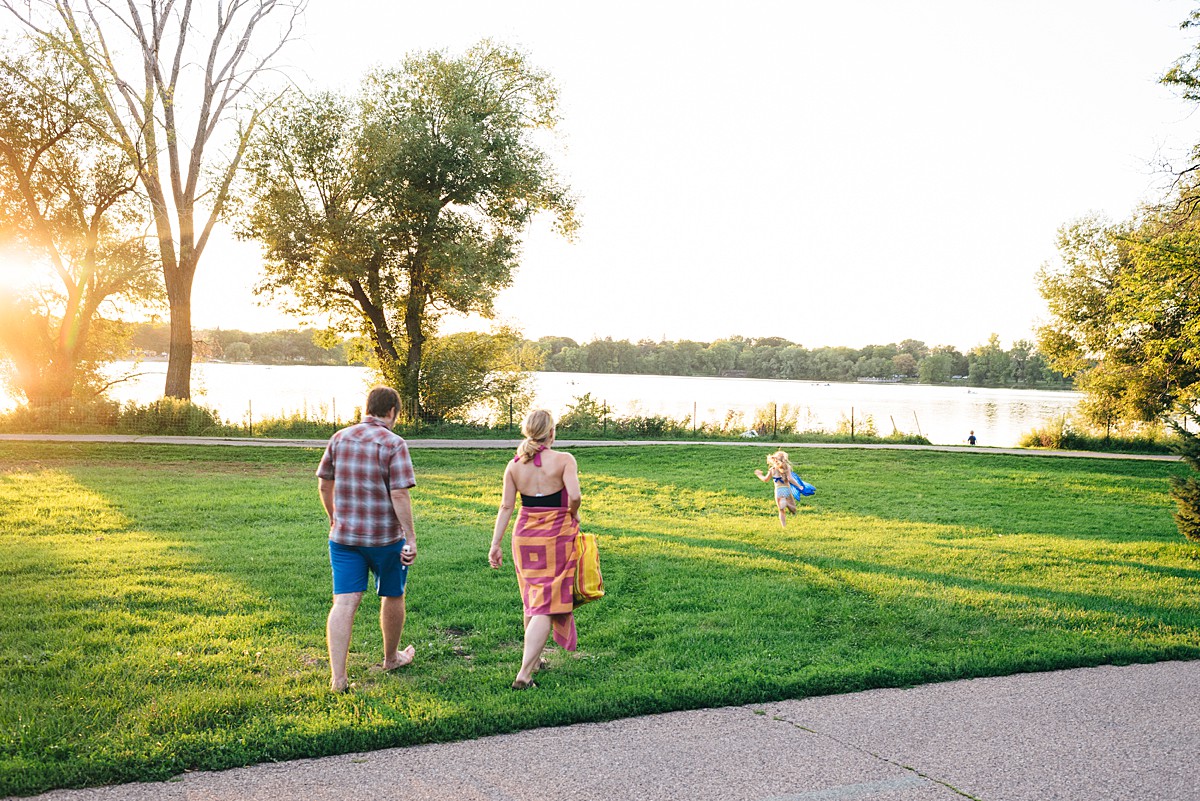 Family walks to lake to swim.