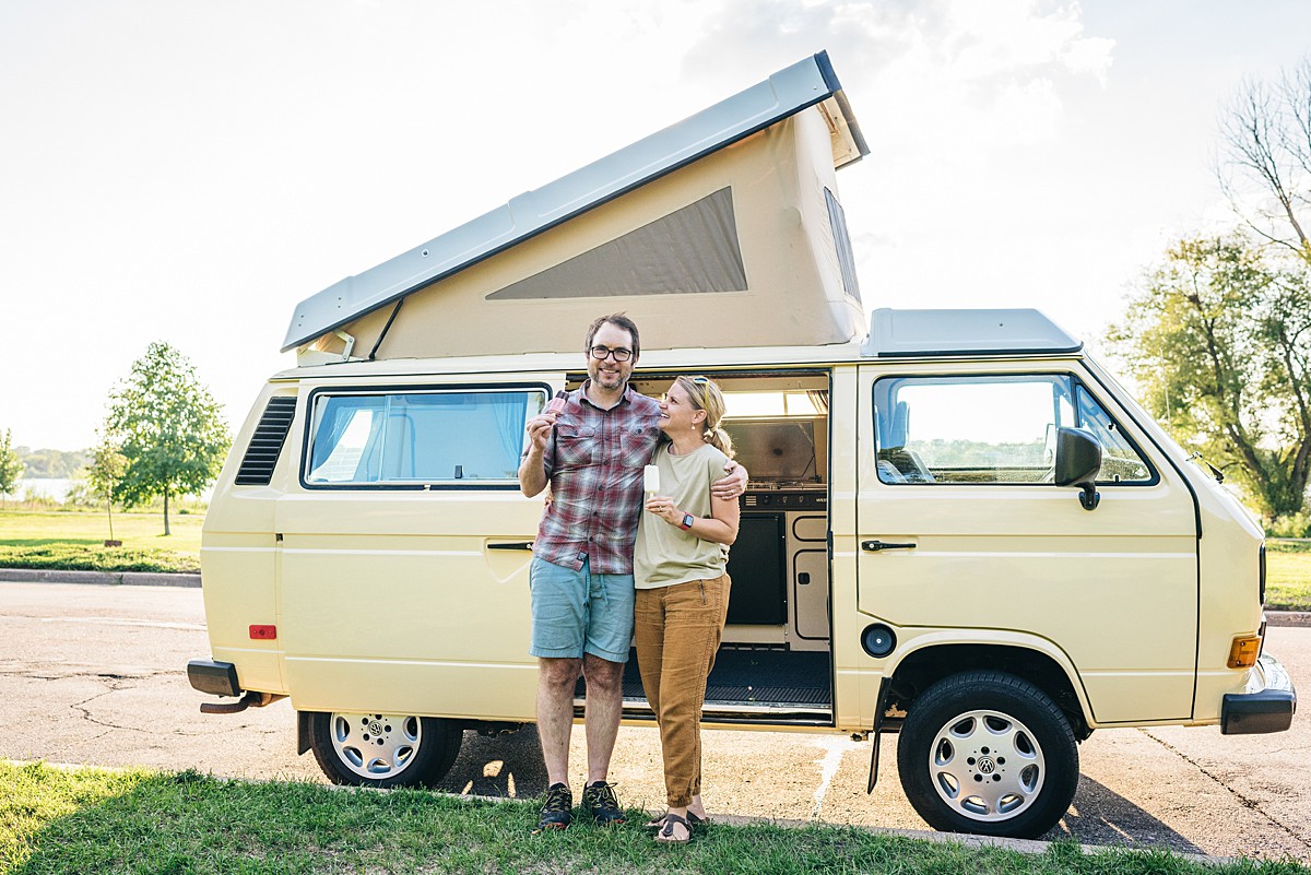 Couple in front of van posing during Minneapolis family film.