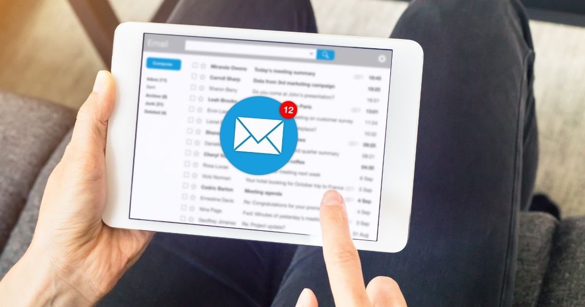 man using ipad with message emoticon man using ipad with message emoticon