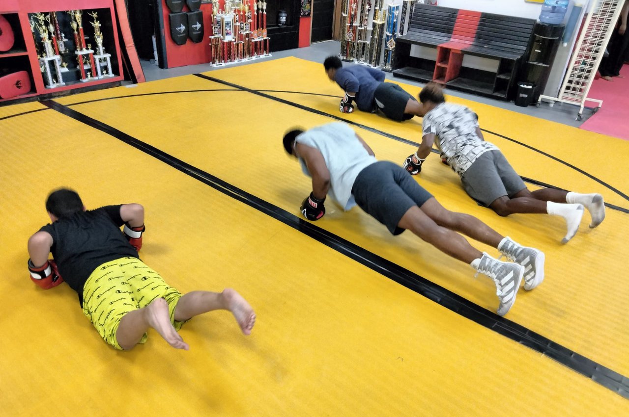 Martial arts instructor with kids
