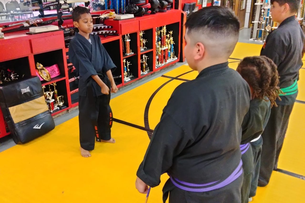 Martial arts instructor with kids