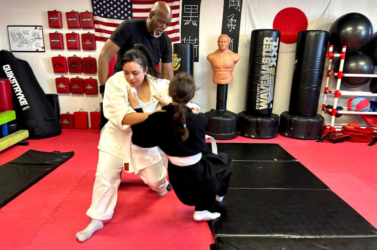 Martial arts instructor with kids