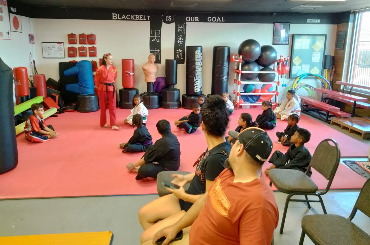 Martial arts instructor with kids