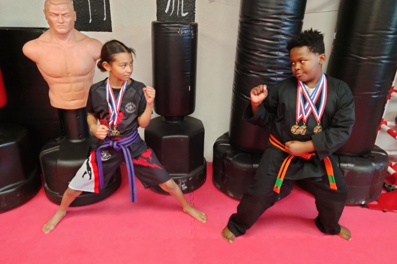 Martial arts instructor with kids