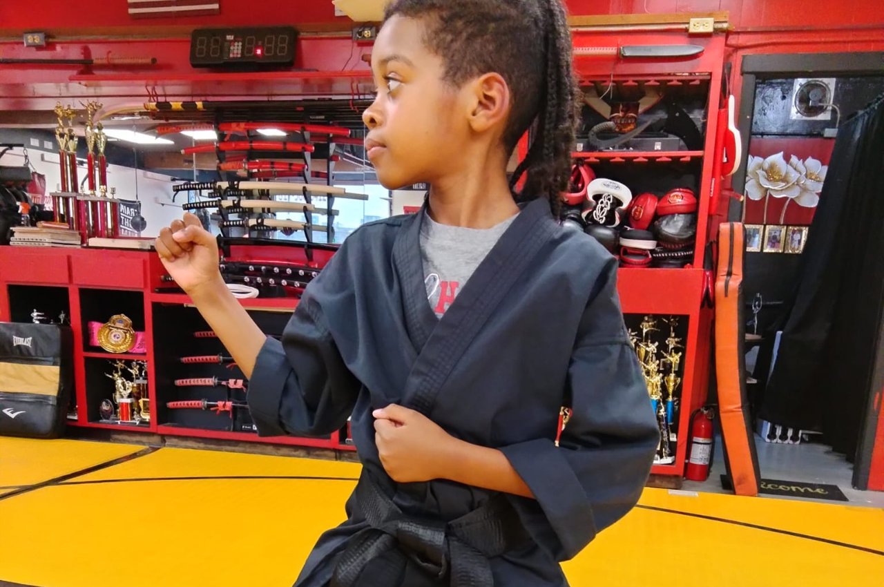 Martial arts instructor with kids