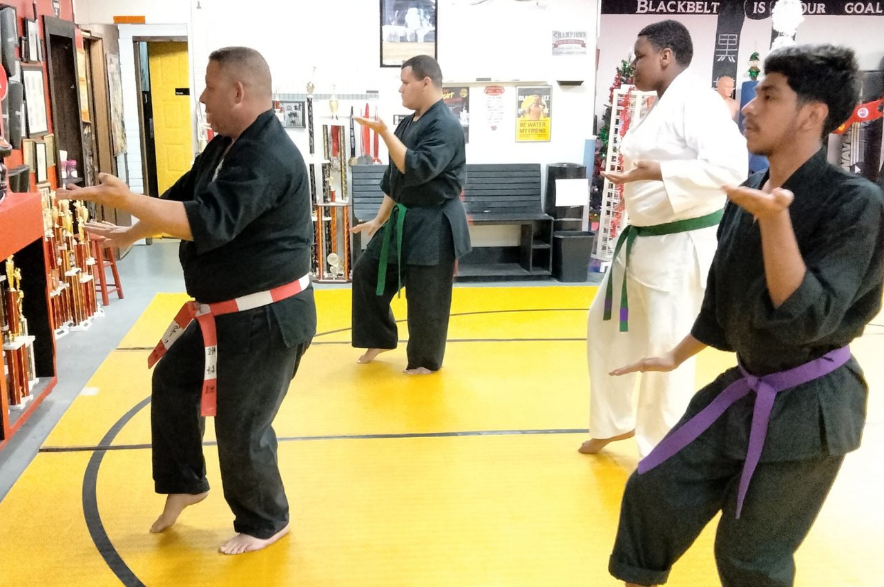 Martial arts instructor with kids