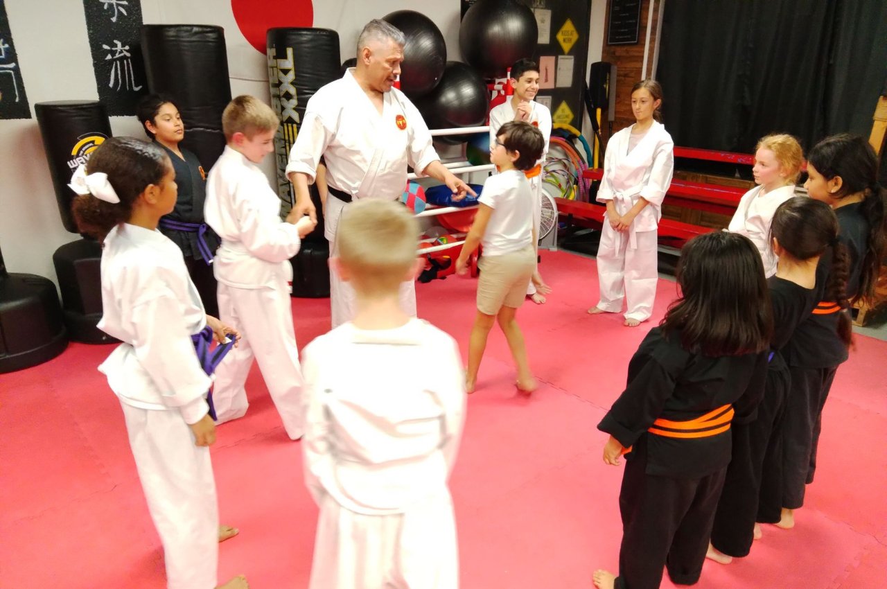 Martial arts instructor with kids