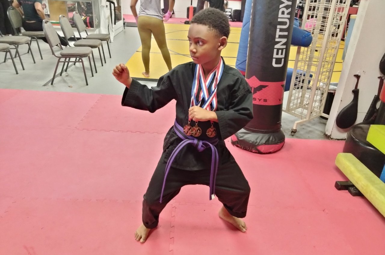 Martial arts instructor with kids