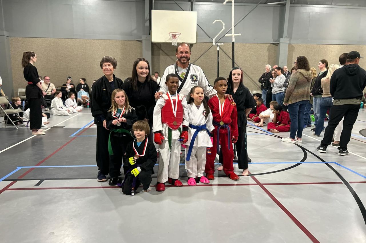 Martial arts instructor with kids