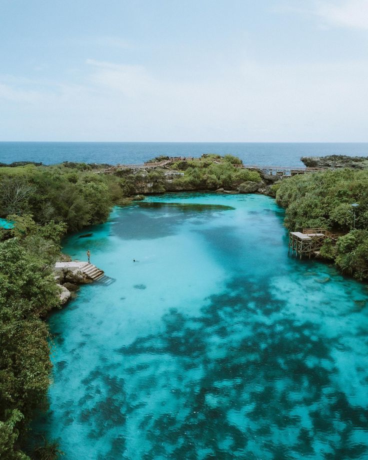 Crystal-clear saltwater lagoon in Sumba framed by white limestone cliffs