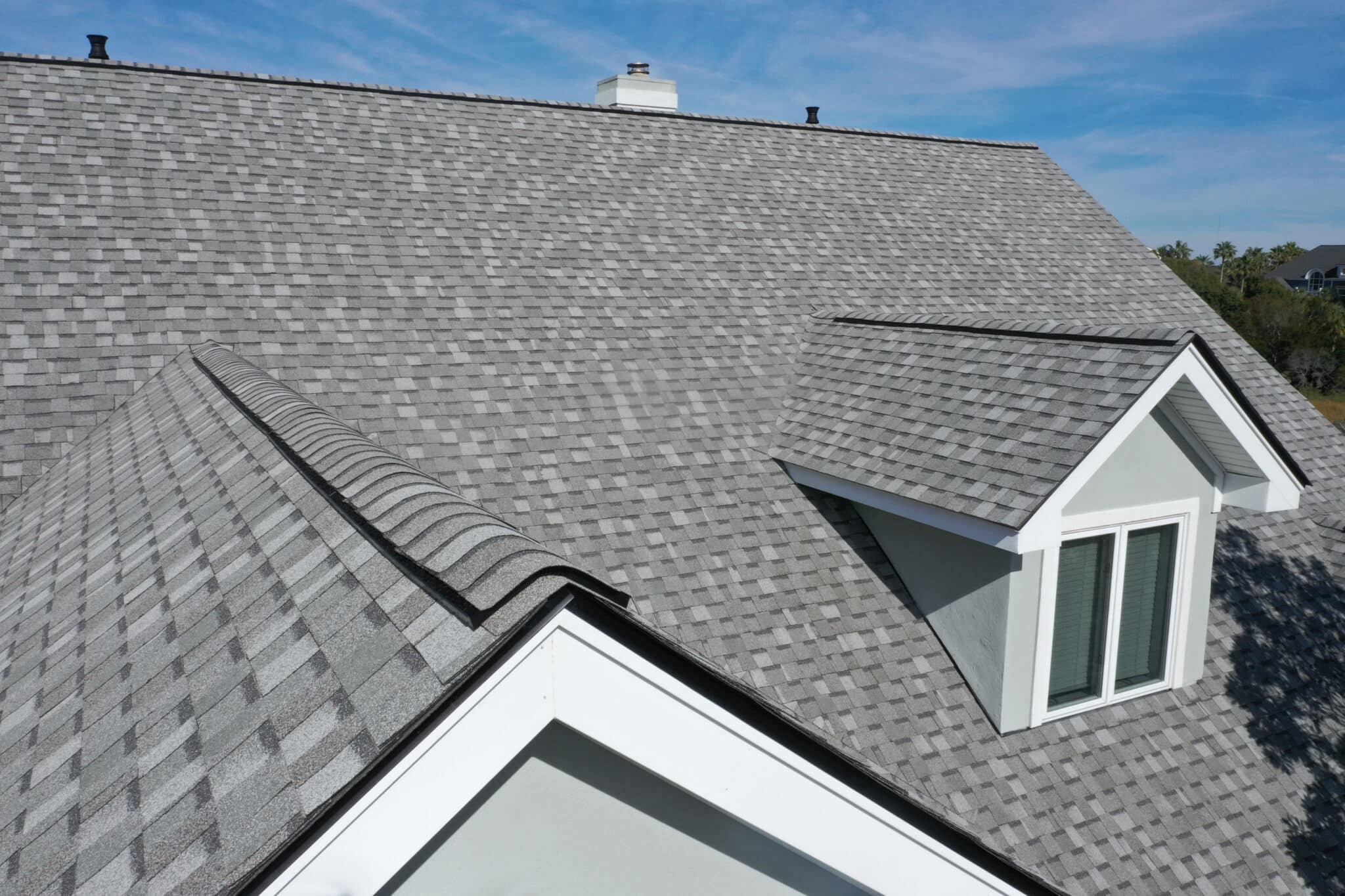 a newly installed shingle roofing