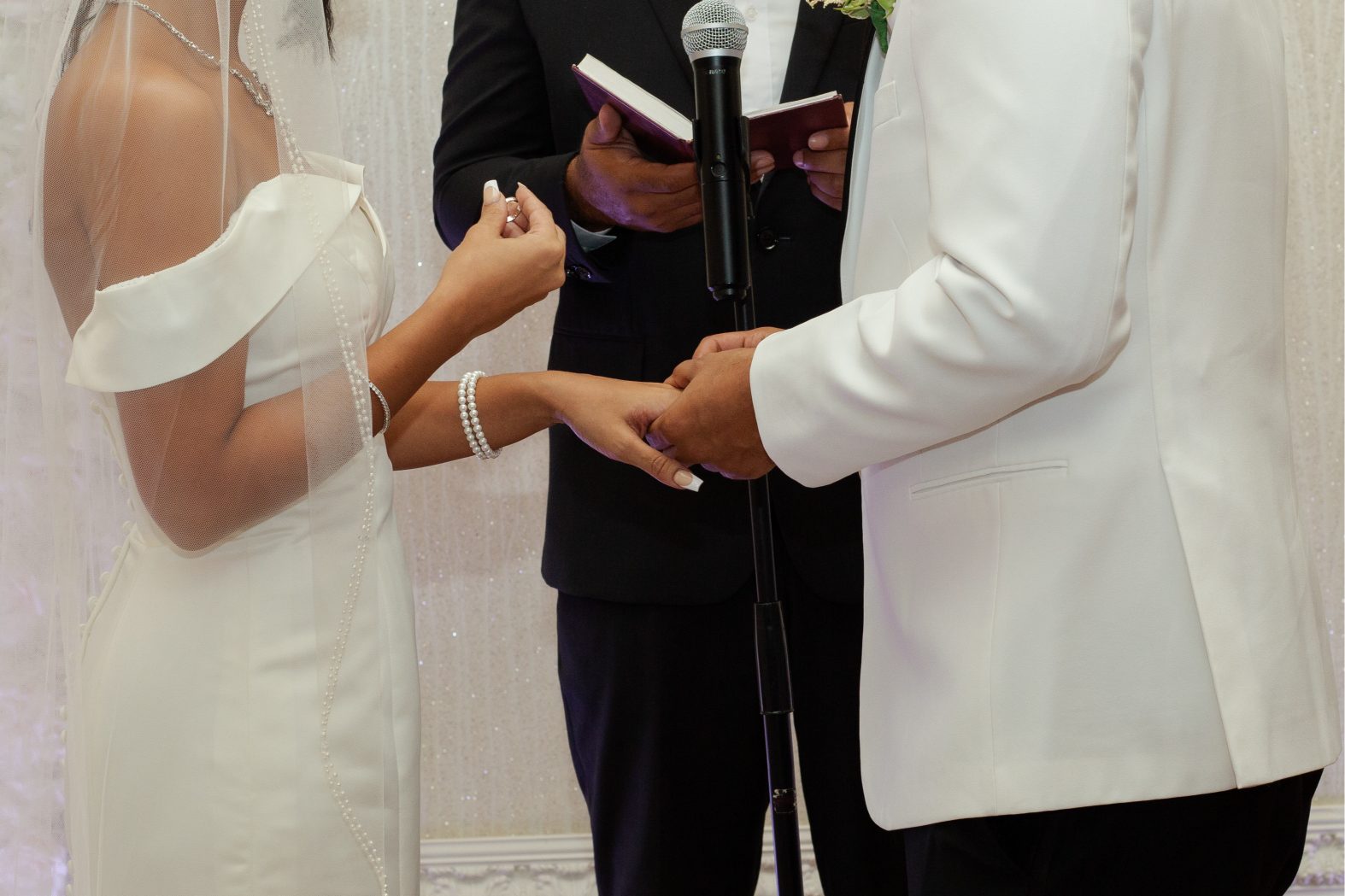 Couple exchanging rings at Crystal Ballroom on the Lake in Altamonte Springs Couple exchanging rings at Crystal Ballroom on the Lake in Altamonte Springs