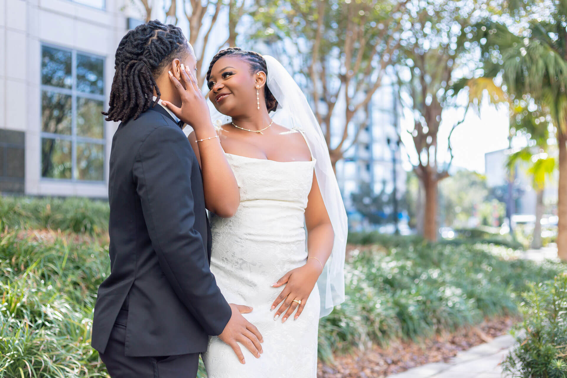 Close-up emotional portrait of newlyweds looking at each other after Orlando courthouse ceremony Close-up emotional portrait of newlyweds looking at each other after Orlando courthouse ceremony