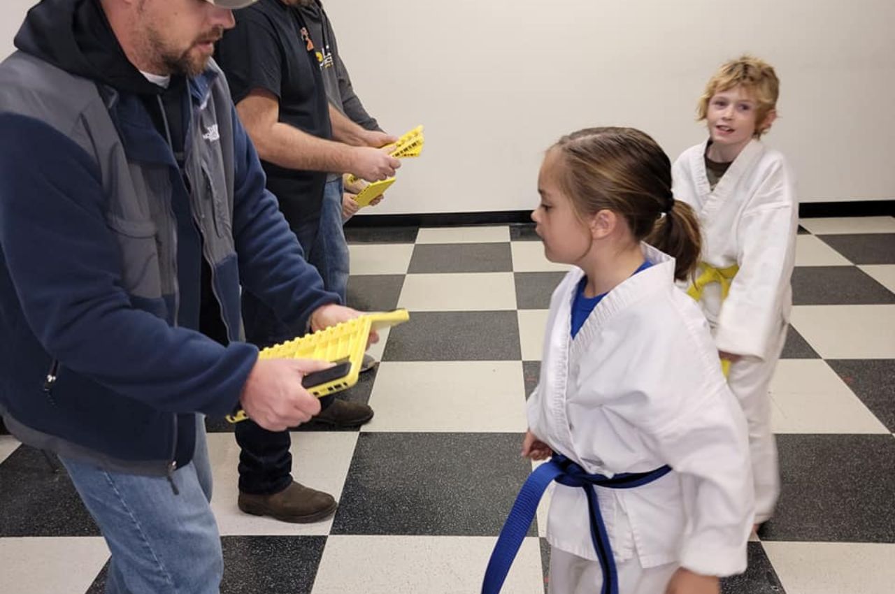 Martial arts instructor with kids