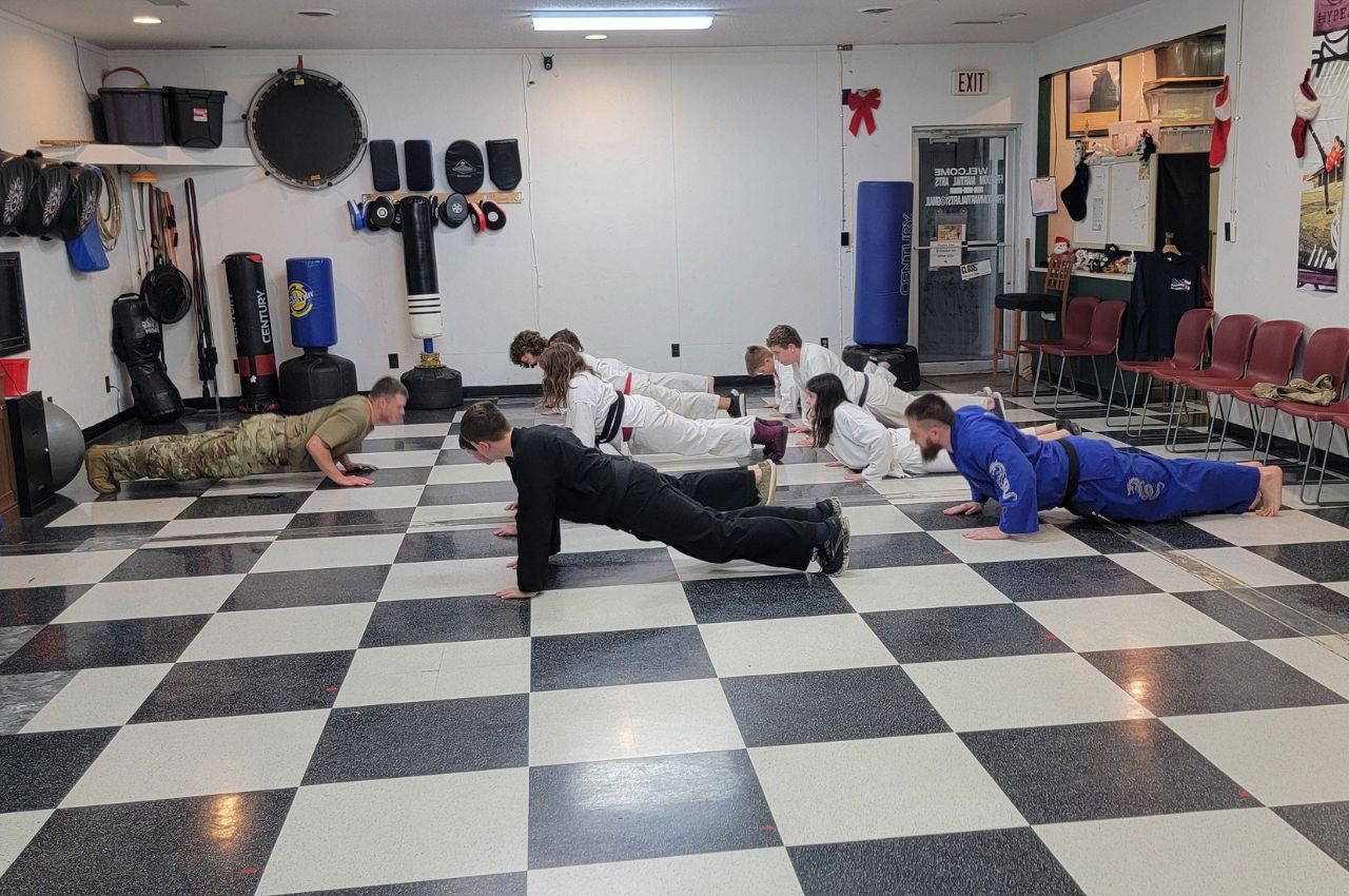 Martial arts instructor with kids