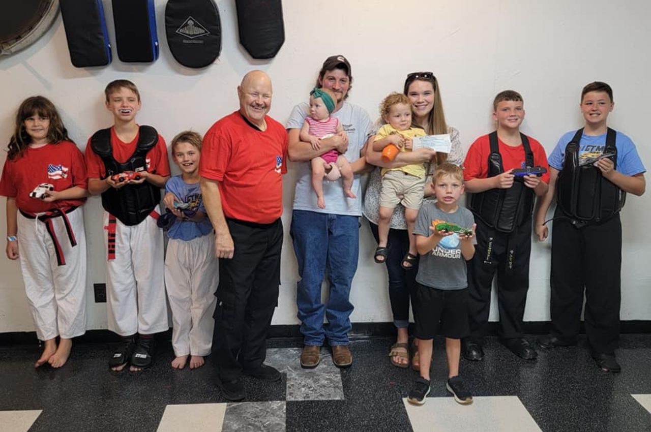 Martial arts instructor with kids