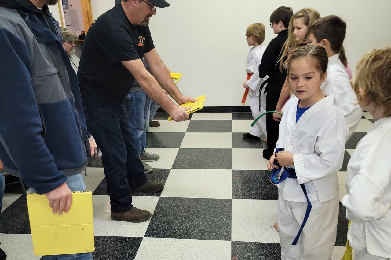 Martial arts instructor with kids