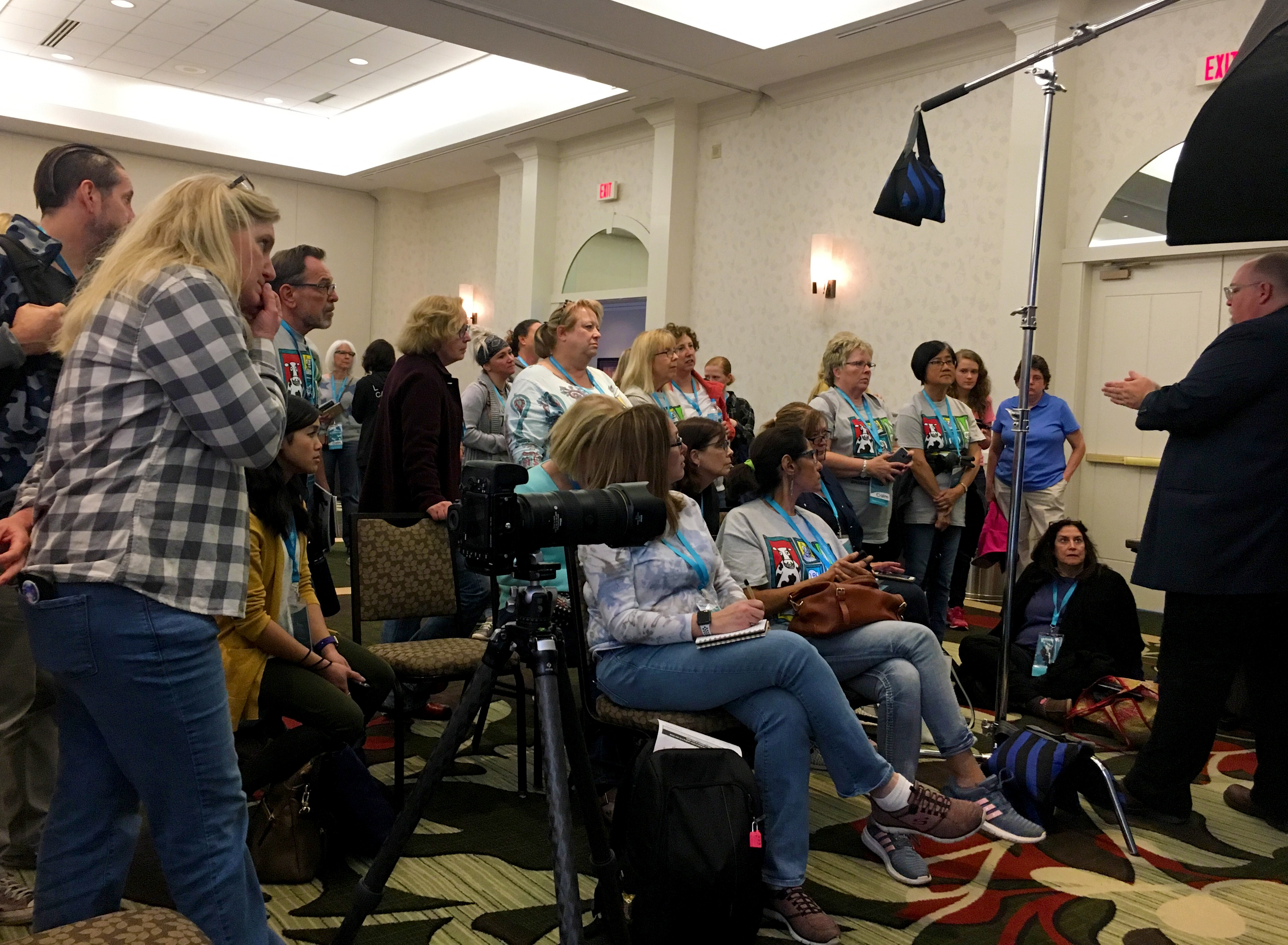 Bud Thorpe  speaking with a group during a demo on the trade show floor at AIM 2019