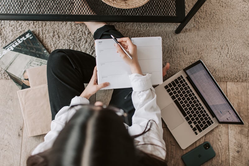 Author planning and writing notes beside a laptop, symbolising the transformation from draft to finished manuscript. Author planning and writing notes beside a laptop, symbolising the transformation from draft to finished manuscript.
