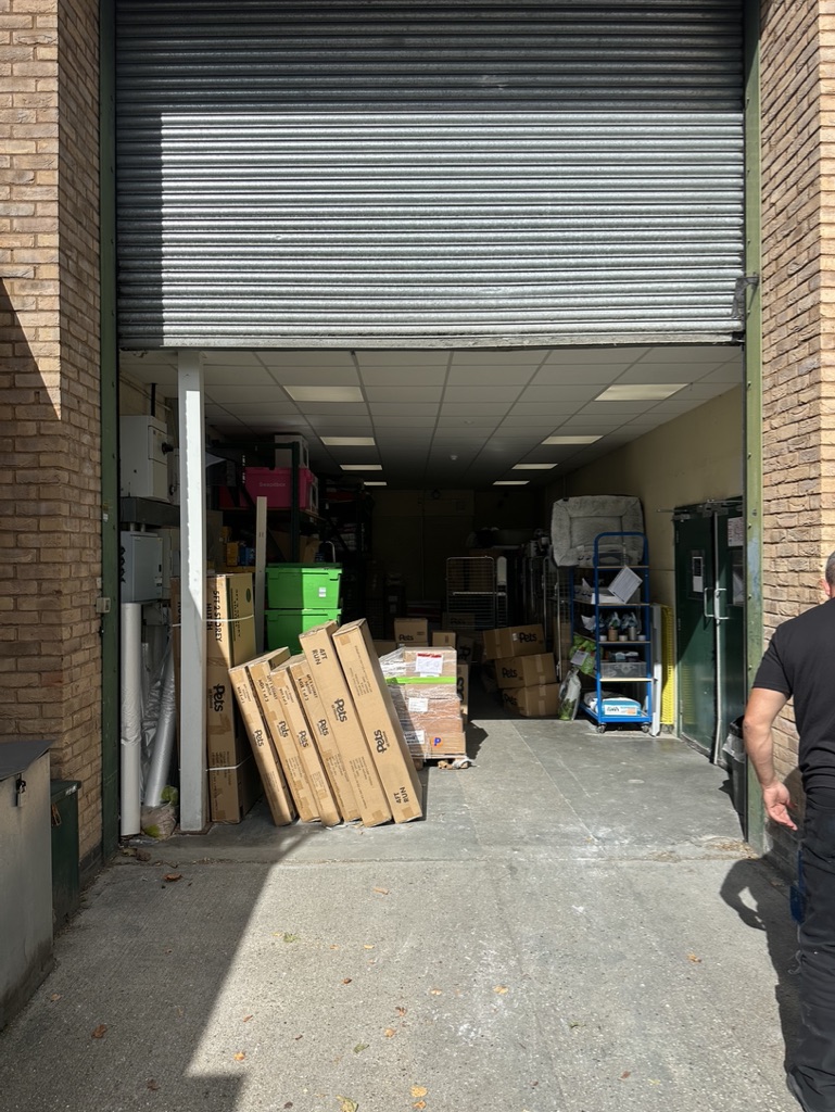 Technician performing roller shutter service contract in Southend, Essex warehouse Technician performing roller shutter service contract in Southend, Essex warehouse