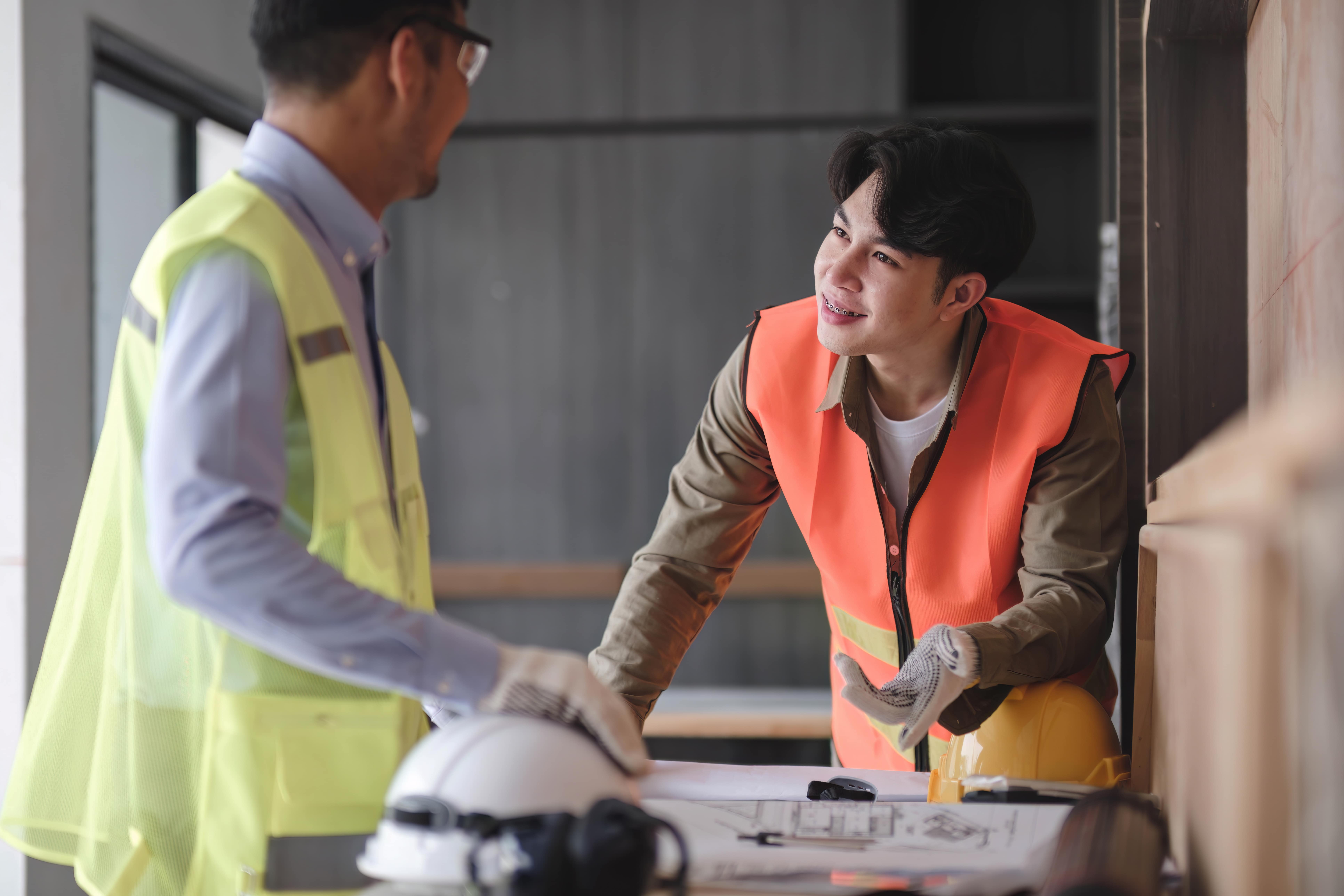 Client and Legend Roofing company's roofing expert talking about roof replacement