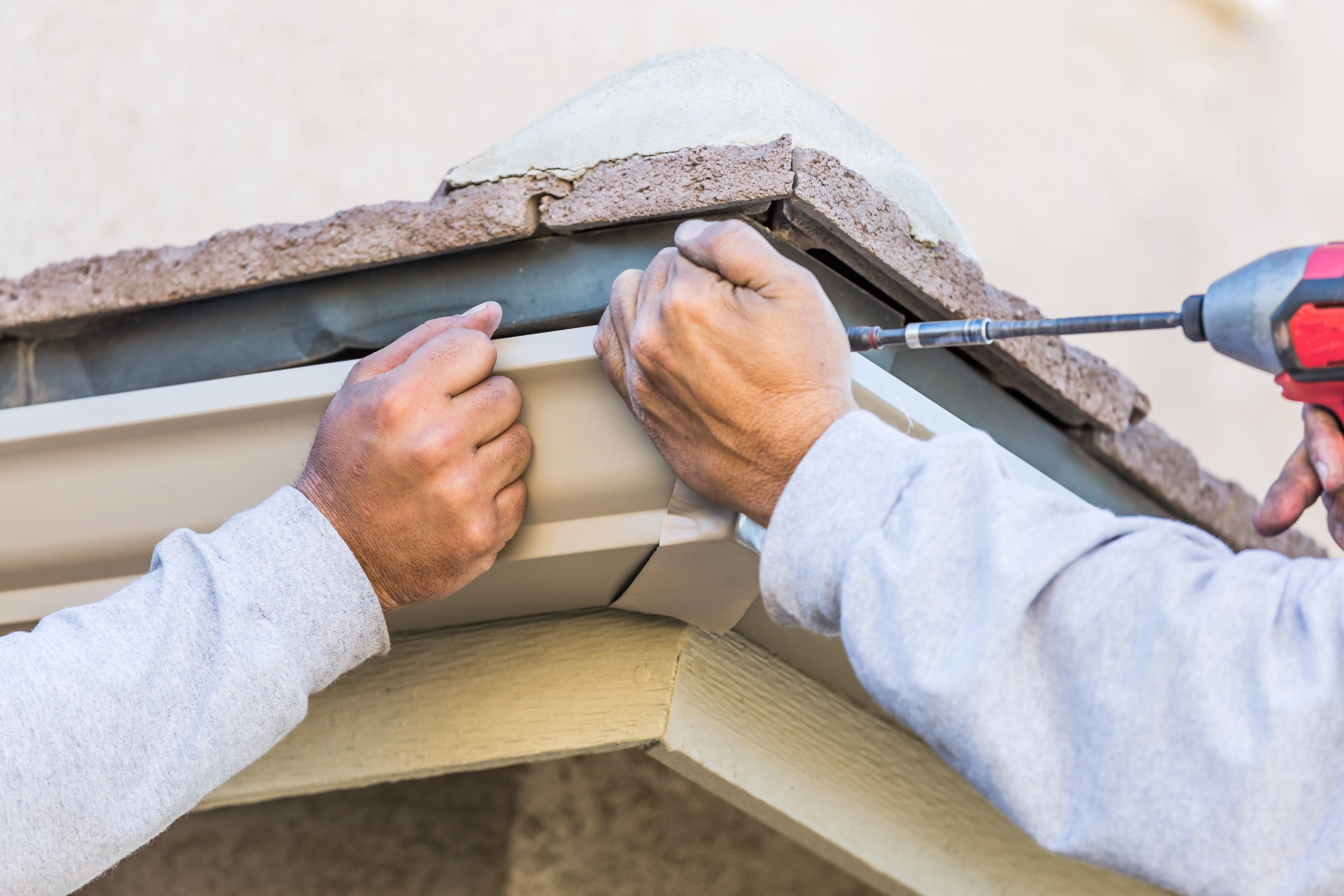 experts installing gutter