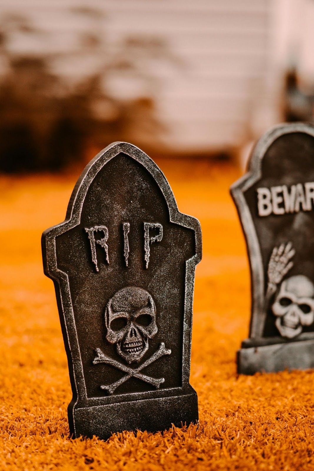 Halloween tombstone decoration engraved with "RIP" text and skull imagery, symbolising career-killing interview mistakes to avoid