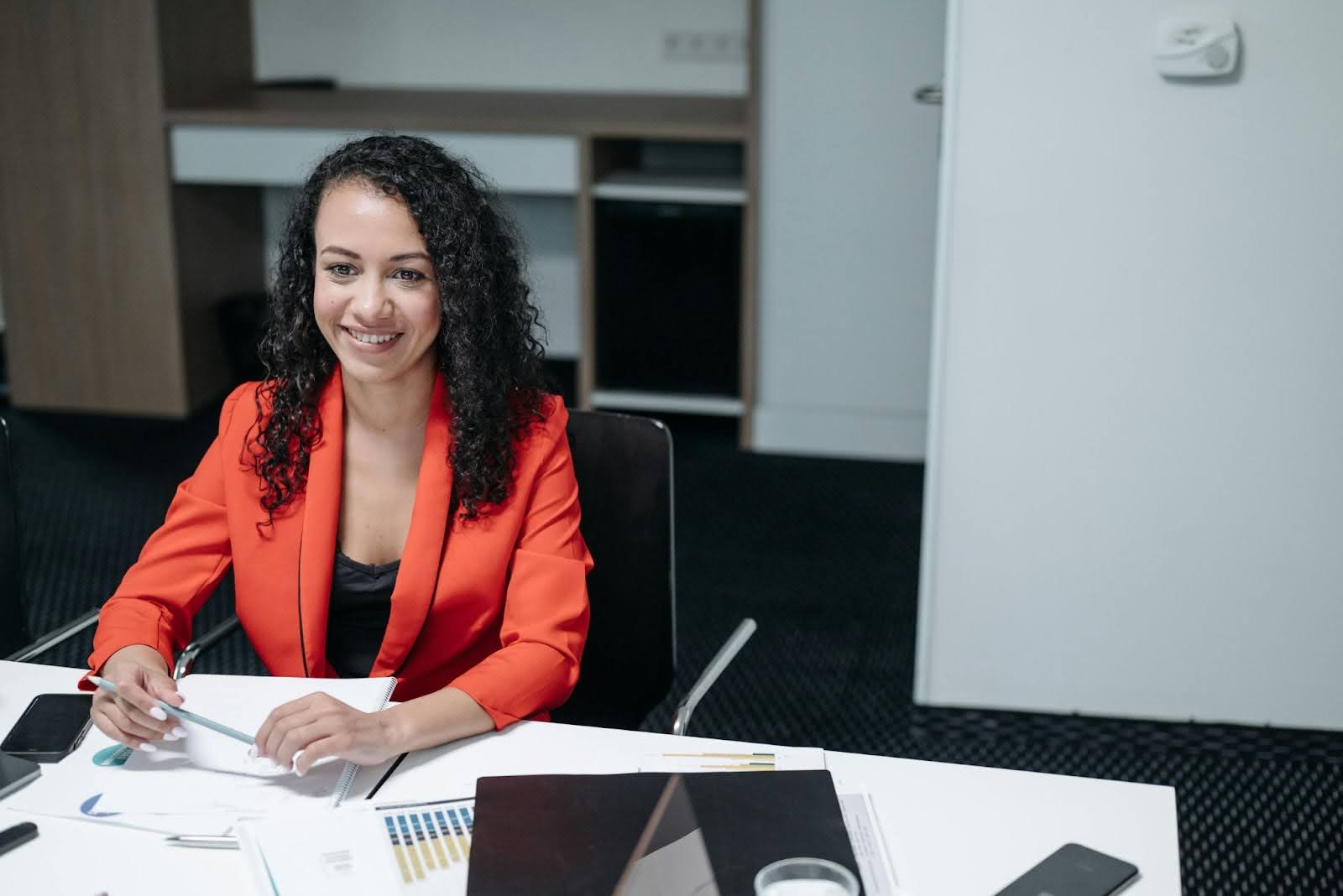 Professional woman displaying genuine smile and positive facial expressions for job interview body language success