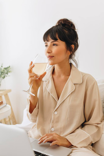 Lady drinking berry-flavored calming cocktail Lady drinking berry-flavored calming cocktail