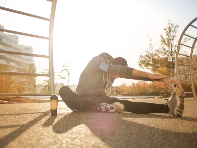 man stretching before playing sports