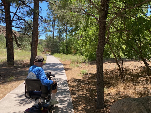 Dad in scooter at Bandelier National Park Dad in scooter at Bandelier National Park