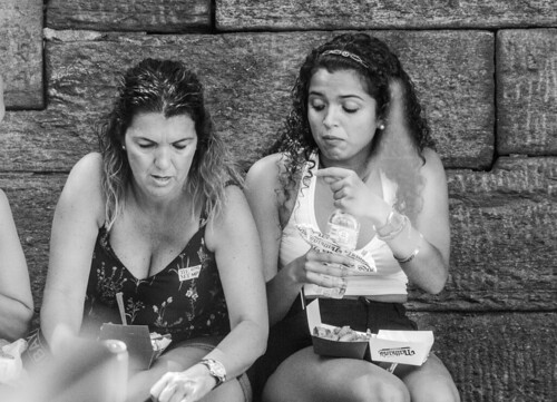 woman eating nathans while sitting