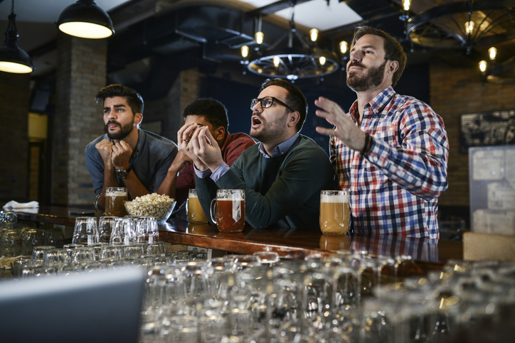 bar patrons watching football