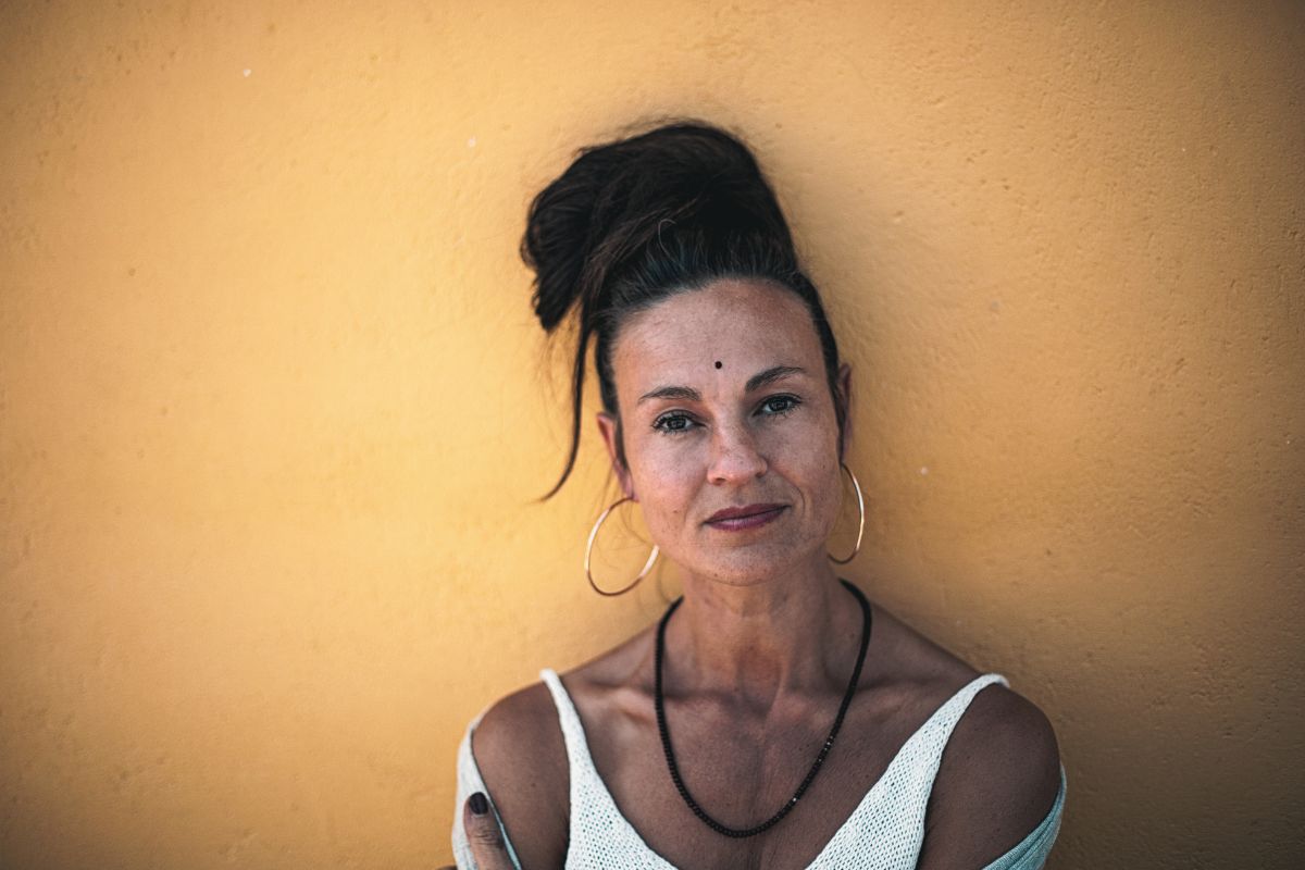 spiritual and dark haired woman looking right at the camera, with no ego spiritual and dark haired woman looking right at the camera, with no ego