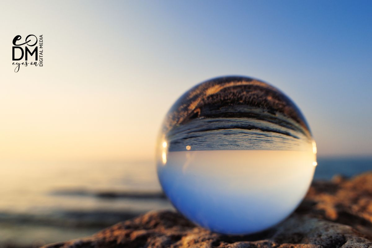glass ball in front of the ocean in a sunset glass ball in front of the ocean in a sunset
