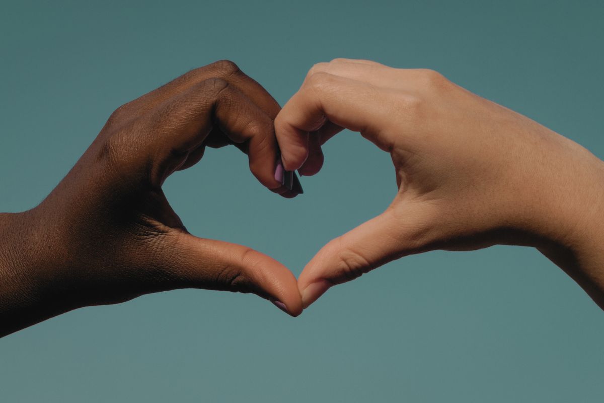 two hands together, making a heart, symbolising friendship two hands together, making a heart, symbolising friendship