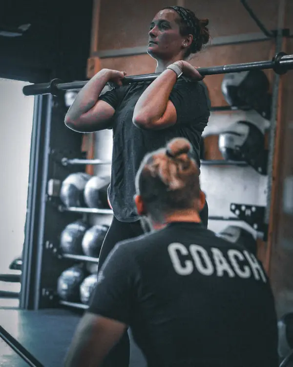 Personal training coach working with member at Crooked River CrossFit gym in Mayfield Village Ohio