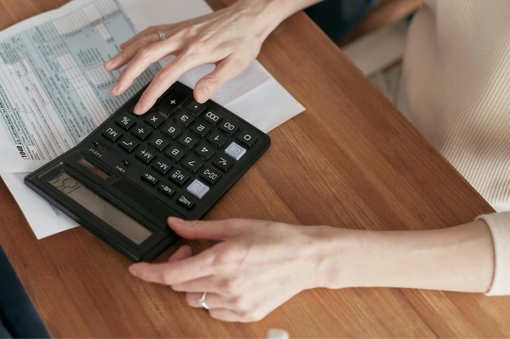 hands calculating bill payments