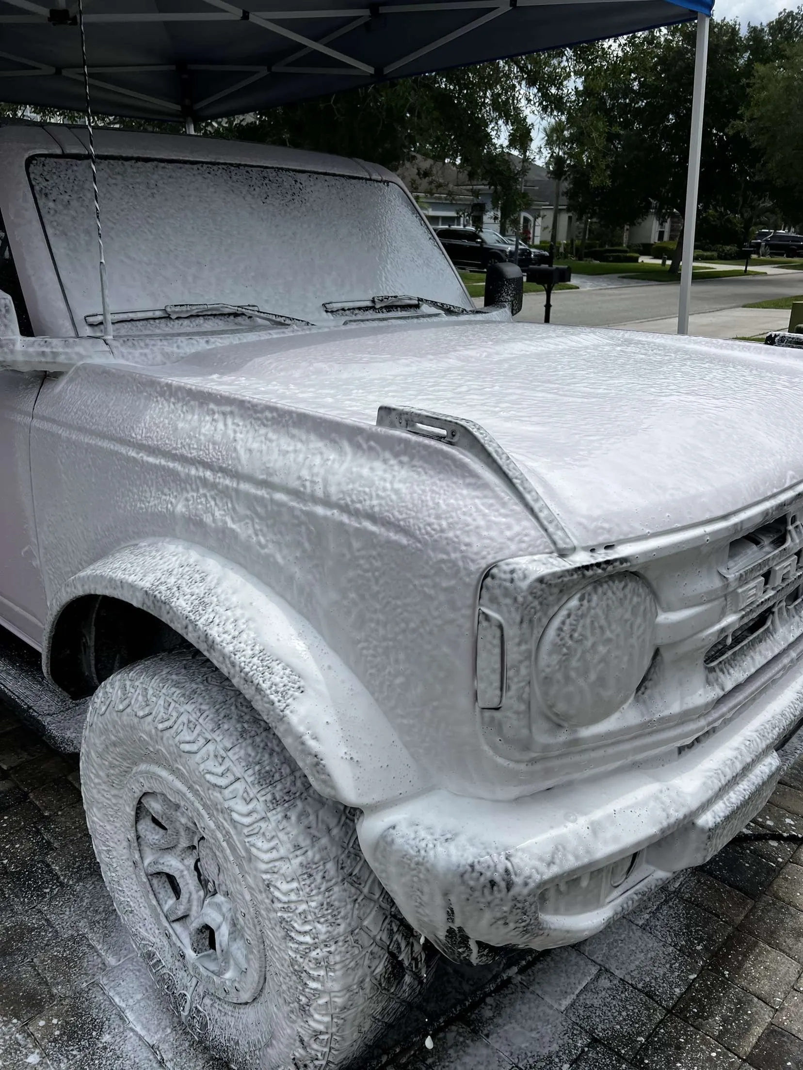 Vehicle covered in foam during maintenance wash