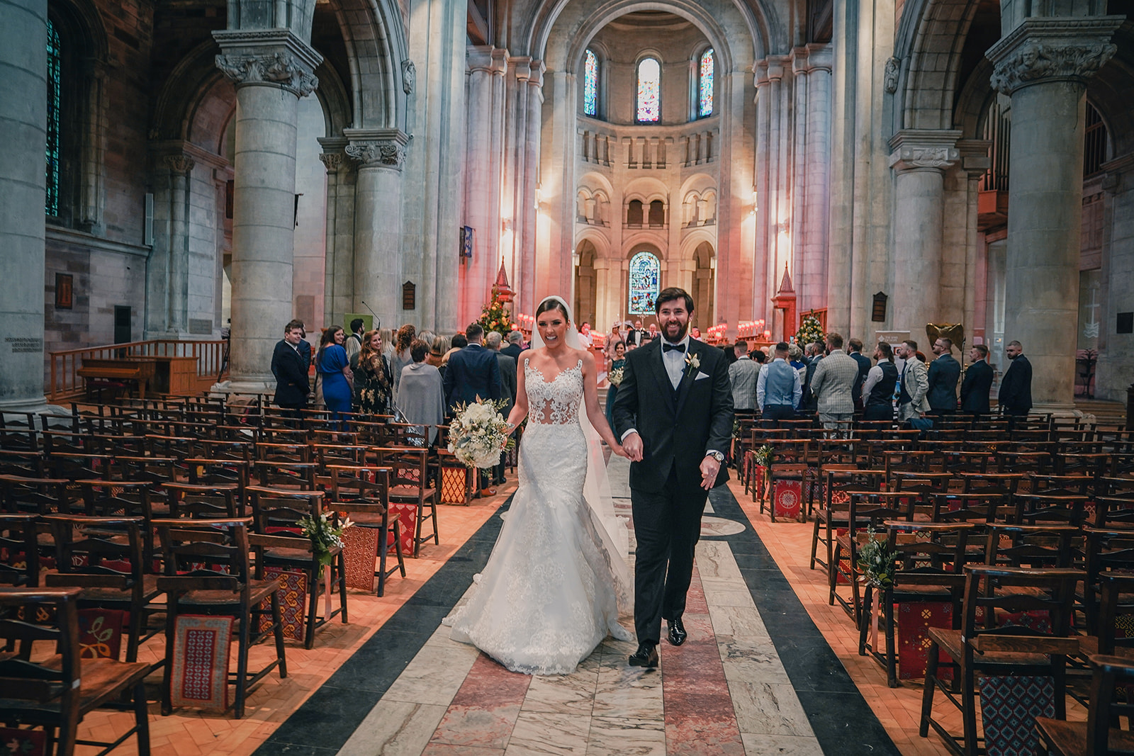 Bride and groom walking down the aisle after wedding ceremony Belfast