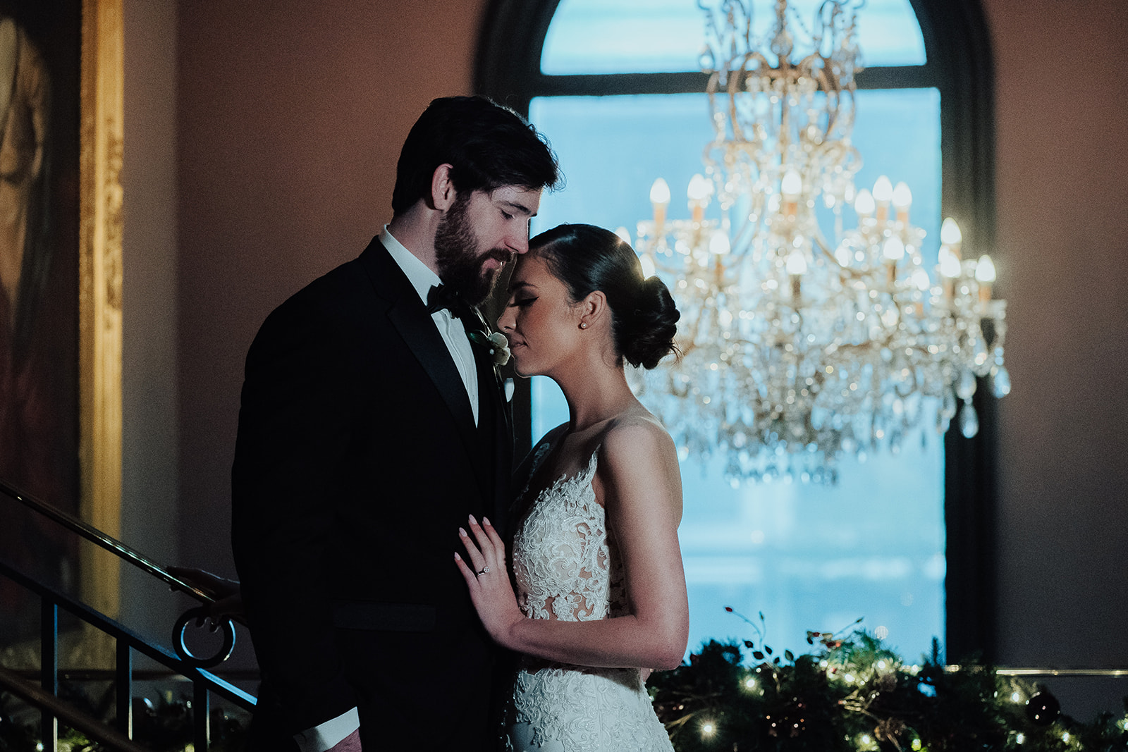 Romantic wedding portrait under chandelier in Belfast wedding venue