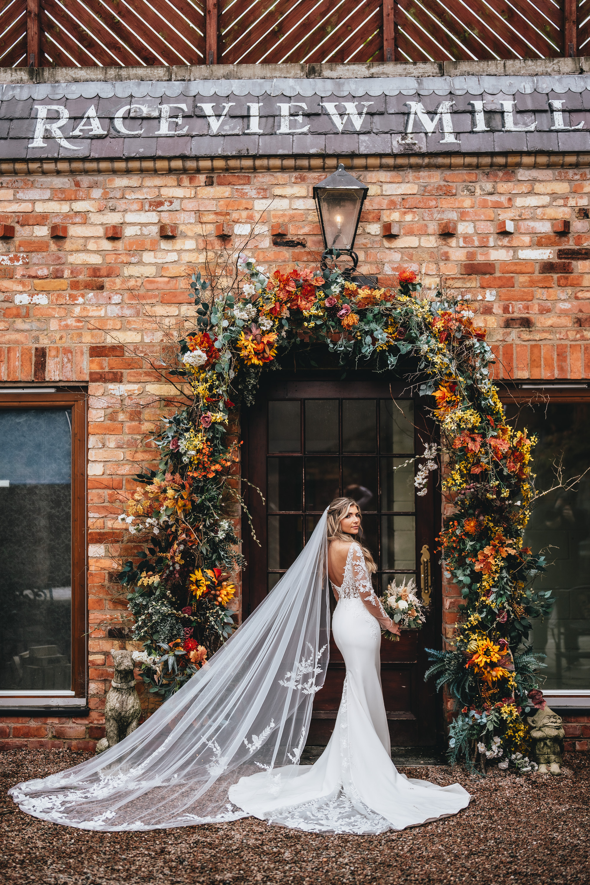 bride portrait against red brick at the wooltower wedding venue
