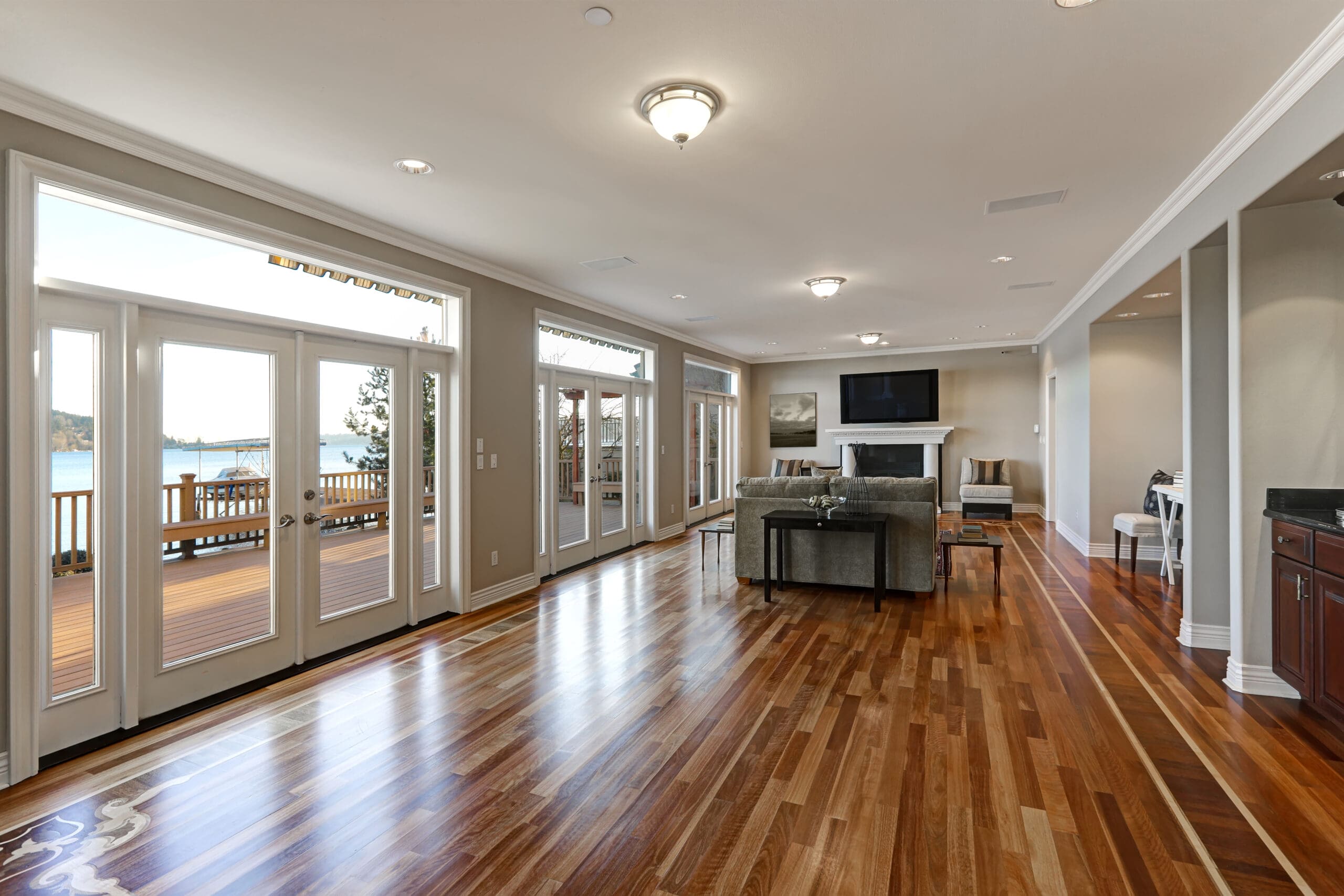 a living room with glass doors and windows