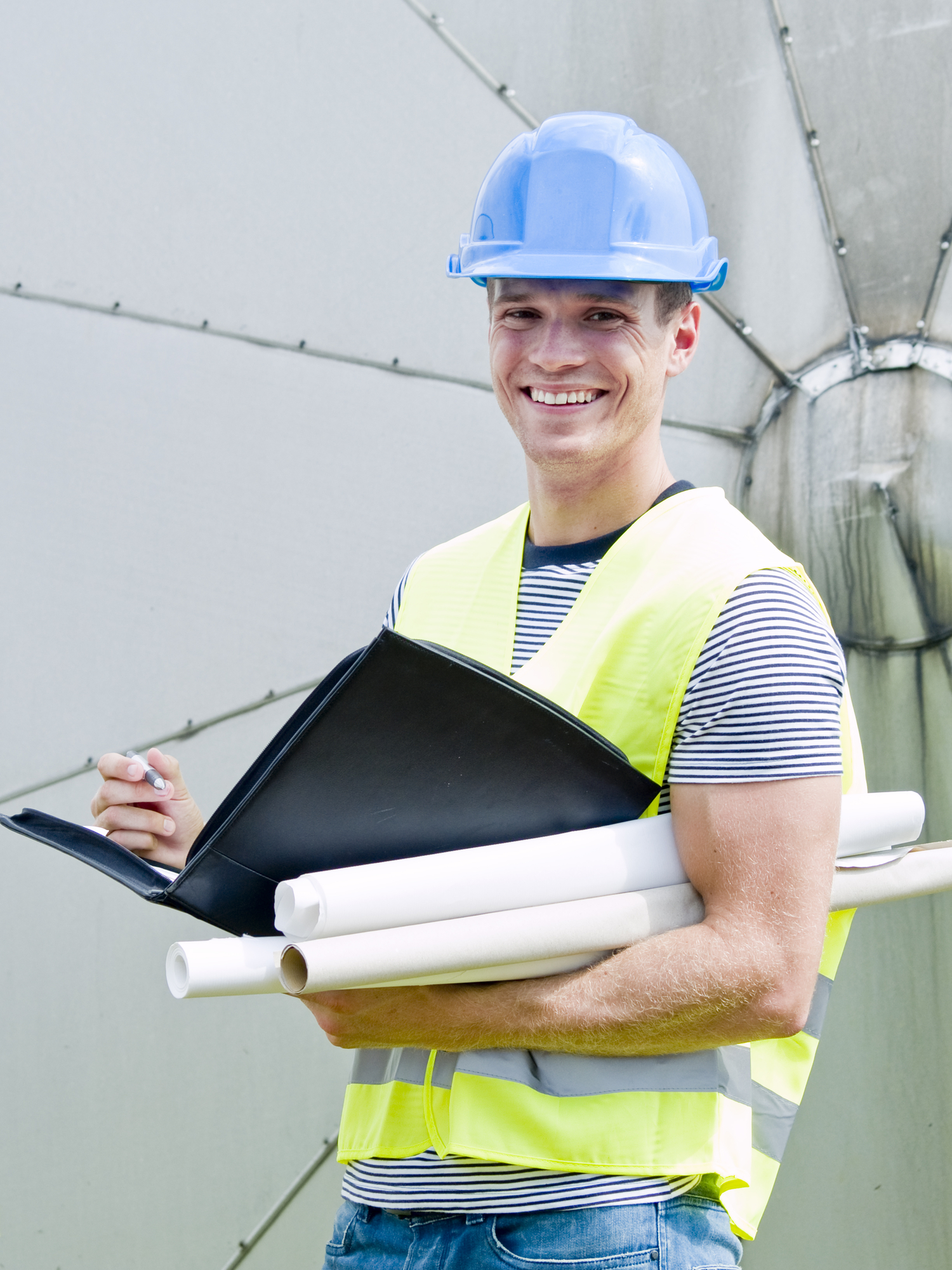 Construction worker looking at the diagrams and blueprints